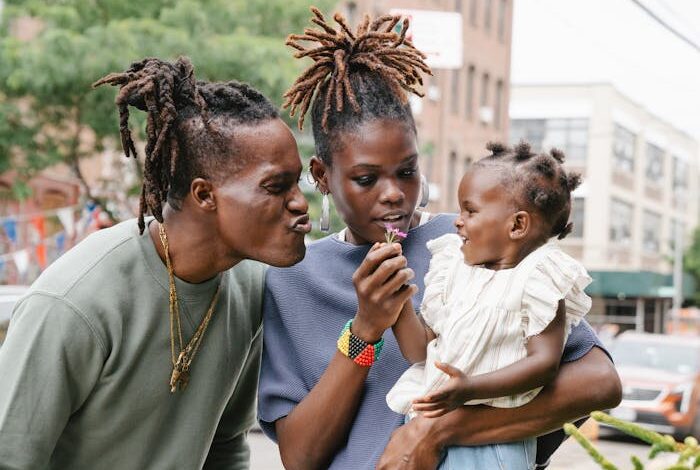 A joyful family bonding moment captured on a city street, highlighting love and togetherness.